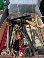 Overall view of flat containing assorted tools and power bar