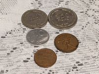 Obverse sides showing denominations 100, 250 and three smaller coins