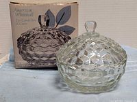Candy dish with lid beside original box