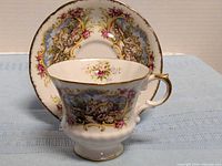 Cup front and saucer showing pattern and gilt