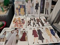 Group shot showing eight pattern envelopes from Vogue, McCall’s and Burda
