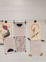 Six transfer sheets clipped on wire
