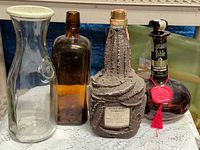 group shot of four vintage bottles