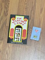 Front view of book and sealed promotional deck