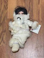 Full view of Alaskan Friends porcelain doll showing overall condition