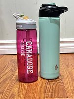 Front view of both bottles standing upright