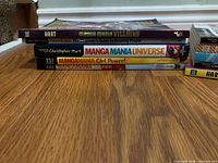Stack showing Manga Mania Villains, Universe, Girl Power!, Shonen and Figure It Out spines