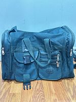 Front view showing pockets, handles and overall color