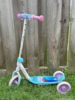 Full side view of the Frozen themed three-wheel scooter