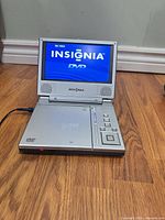 Player open and powered on displaying Insignia splash screen
