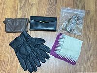 Full lot overview showing gloves, pouch, wallet, frames in bag, scarf