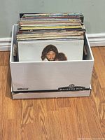 Box filled with numerous 12-inch LP records