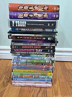 Full stack of DVDs showing variety of titles and case conditions