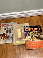 Front covers of all three woodworking plan books
