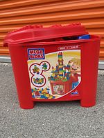 Front view of red Mega Bloks storage bin showing model 8869 and 250 piece count