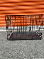 Overall view of crate side showing wire construction and tray
