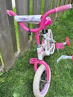 Front view showing handlebars, frame color and front wheel