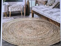 Stock photo of nuLOOM round jute area rug in room setting