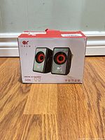 Front of boxed OROW S206 speakers showing product image and branding