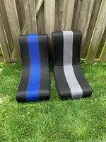 Front view of both black floor chairs displaying blue and grey stripes