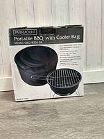 Front of retail box showing Paramount portable BBQ with cooler bag
