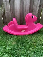 Side view of pink Little Tikes rocking horse