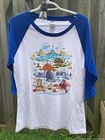 Front view of T-shirt on hanger showing design and colors