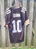 Back view showing QUINN name and large white 10