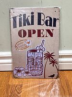 Front of metal sign showing graphics and text