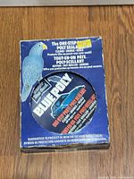 Front of Blue Coral Blue Poly sealant box showing product name and window revealing tin