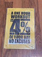 Front of yellow metal sign displaying full motivational text and color scheme