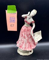 Full view of Coalport Emperor Valse figurine with tag