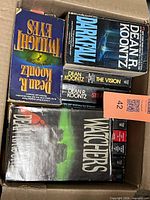 Box of Dean Koontz novels showing Twilight Eyes, Darkfall, The Vision, Strangers, Watchers