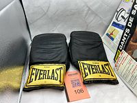 Pair of black Everlast 4302 heavy bag gloves front view