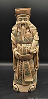 Front view of full figurine showing overall design and colors