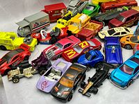 close view left side showing sports cars, ambulance and utility trucks