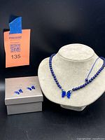 Full set: necklace on bust, earrings on gift box