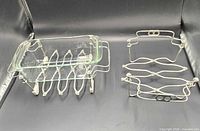 Both trivets, larger shown holding demonstration glass dish