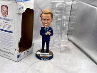 Bobblehead, box with open front, and clear plastic insert