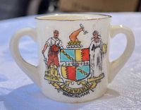 Front view showing Birmingham crest and gold rim