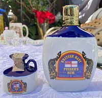 Front view of decanter and separate stopper showing main label and overall coloration