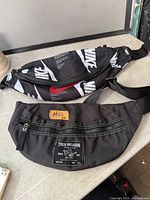 Both waist pack bags laid flat on surface showing overall design