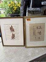 Both framed prints side by side