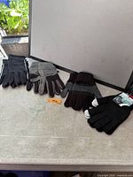 Overview of the four pairs of gloves on table