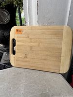 Front view of bamboo cutting board showing handle slot and surface condition