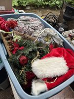 Top view of bin showing Santa hat, artificial greenery and ornaments
