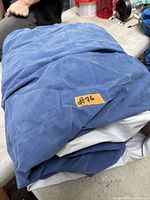 folded blue and white air mattress