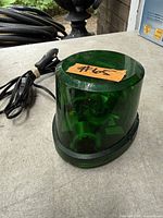 Overall view of green strobe light showing dome and base