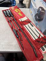 Full view of all four pry bars in red tray packaging