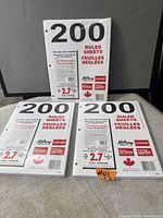 Front view showing three sealed 200-sheet packs of Hilroy ruled loose-leaf paper